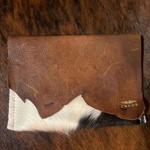 Canoe brand cowhide clutch. Brand new.